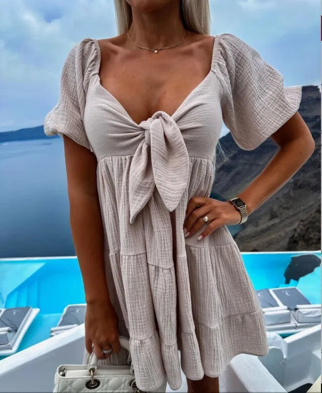 Alaia - Robe à manches courtes avec col en V et nœud sur la poitrine