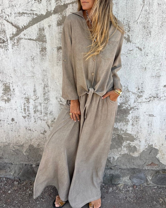 Tenue estivale élégante pour femme avec pantalon bouffant et chemisier boutonné à manches longues