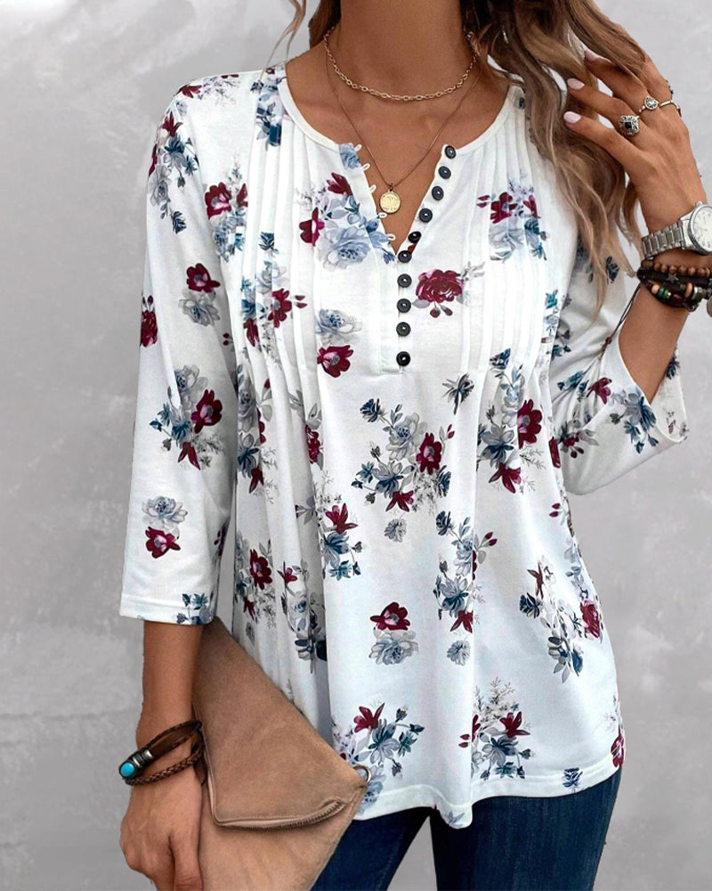 Blouse élégante avec boutons-pression floraux