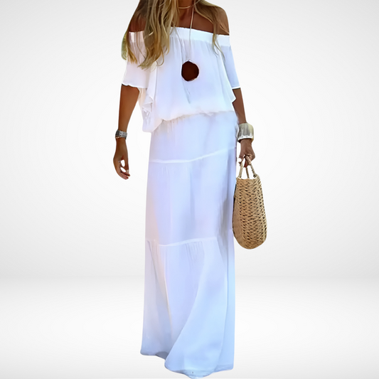 Robe longue blanche élégante à épaules dénudées pour la plage