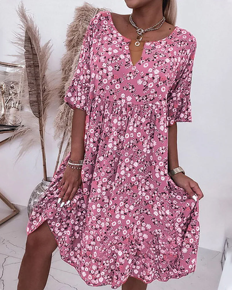 Robe élégante à demi-manches en coton avec motif floral