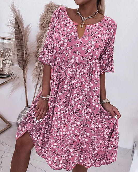 Robe élégante à demi-manches en coton avec motif floral