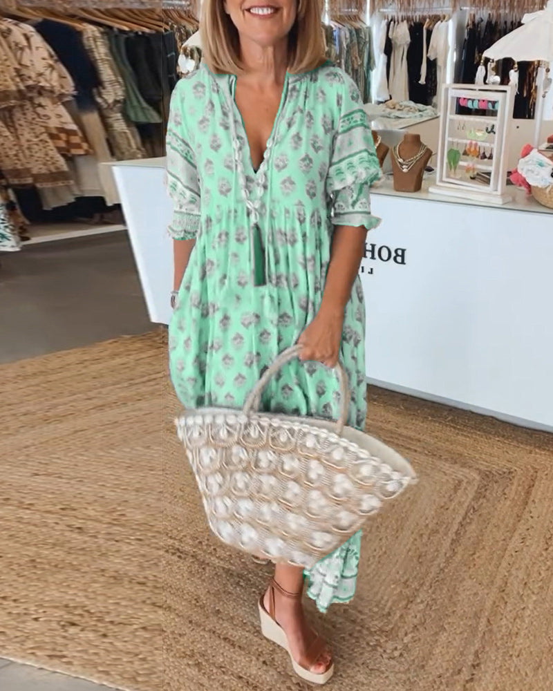 ROBE IMPRIMÉE AVEC COL EN V ET MANCHES SEMI-TRANSPARENTES