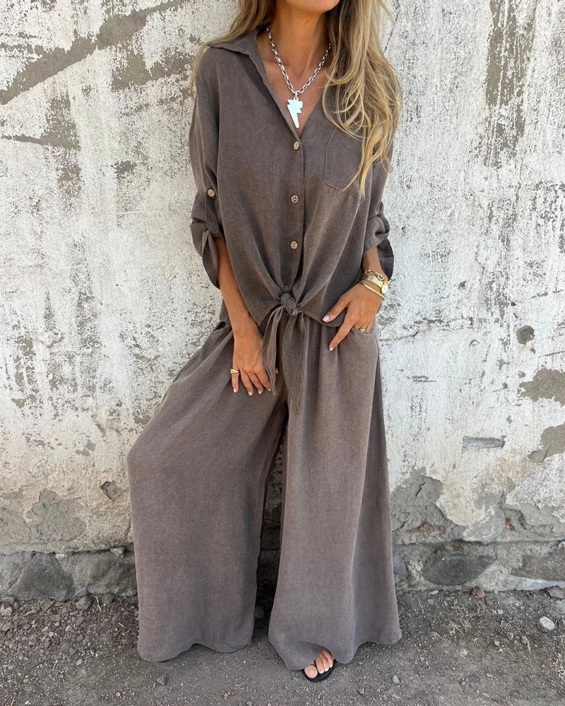 Tenue estivale élégante pour femme avec pantalon bouffant et chemisier boutonné à manches longues
