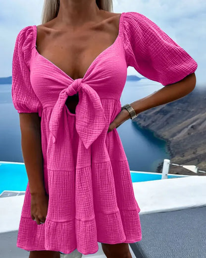 Alaia - Robe à manches courtes avec col en V et nœud sur la poitrine