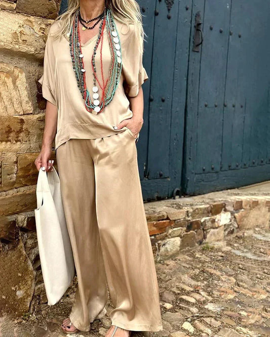 Airelyn - Elégant top blanc avec col en V et jambes larges