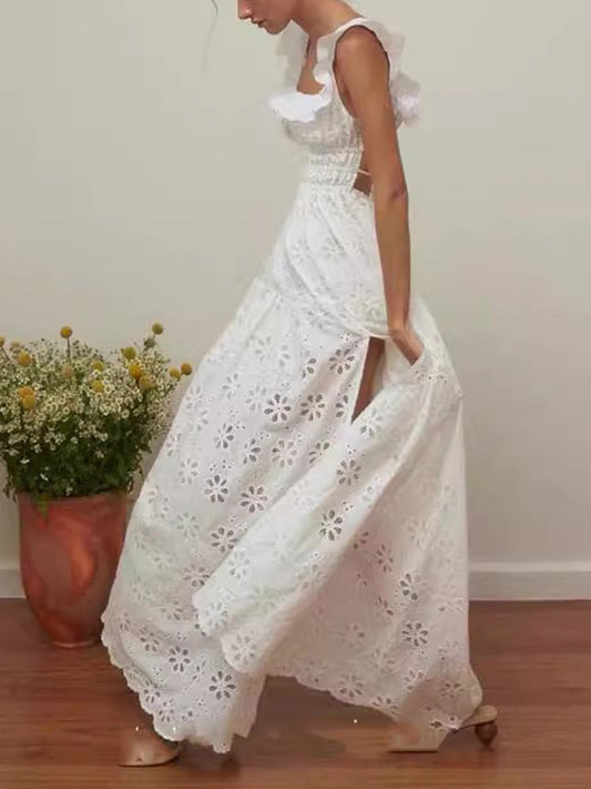 Robe longue avec dos nu, détails apparents et fente sur le côté
