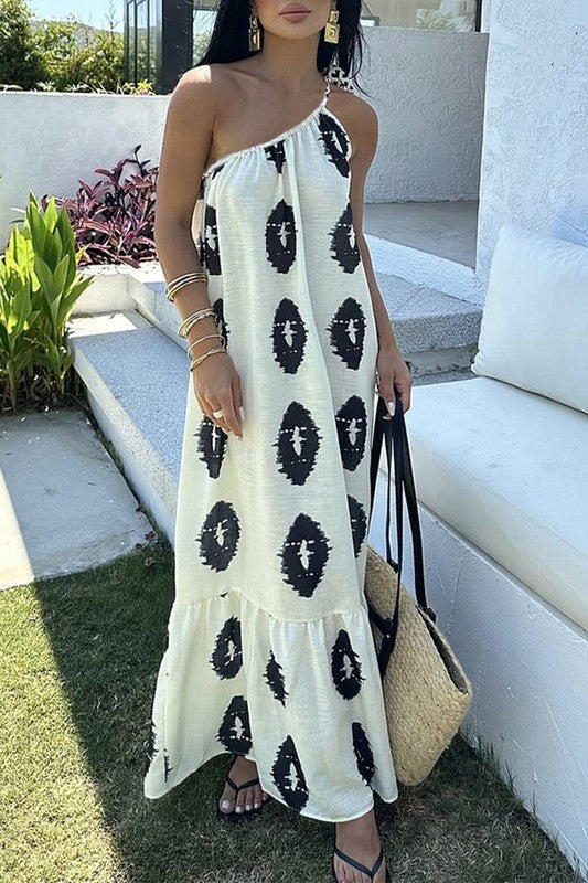 Robe longue imprimée blanche avec bretelles sur une épaule